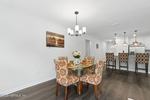 Chandelier, Dining room, Interior, Kitchen, Pendant Lights, Stainless Steel Appliances, Wood Texture Flooring