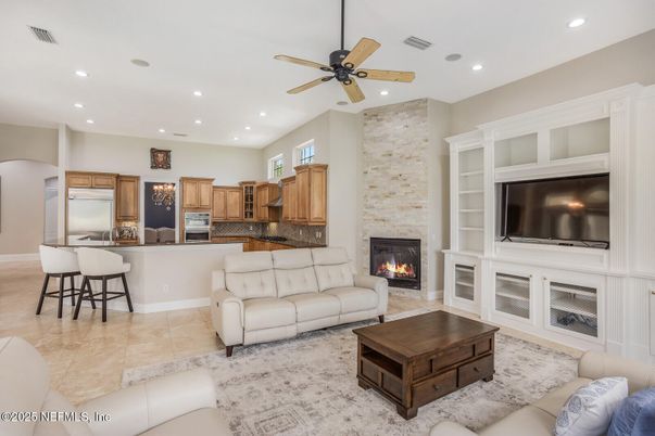 Fireplace, Interior, Kitchen, Living room, Recessed Lighting, Stainless Steel Appliances, Stone Walls