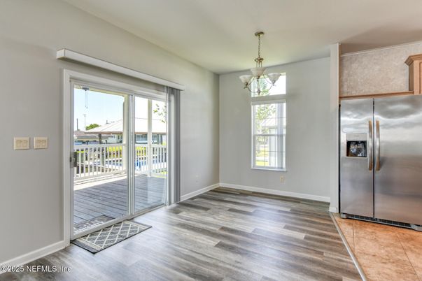 Empty room, Interior, Kitchen, Pendant Lights, Stainless Steel Appliances, Wood Texture Flooring
