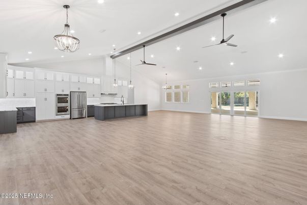 Chandelier, Empty room, Interior, Kitchen, Pendant Lights, Recessed Lighting, Stainless Steel Appliances, Wood Texture Flooring