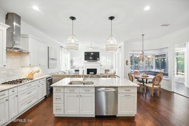 Dining room, Fireplace, Interior, Kitchen, Pendant Lights, Recessed Lighting, Stainless Steel Appliances, Wood Texture Flooring