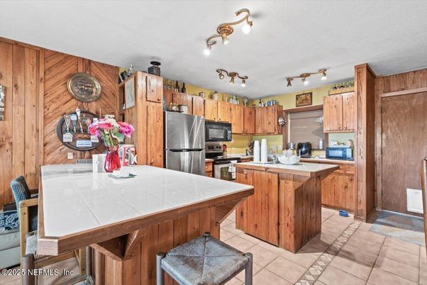 Interior, Kitchen, Stainless Steel Appliances, Tile Countertops, Wooden Walls
