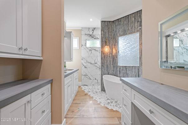 Bathroom, Free Standing Baths, Interior, Marble Walls, Recessed Lighting, Wood Texture Flooring