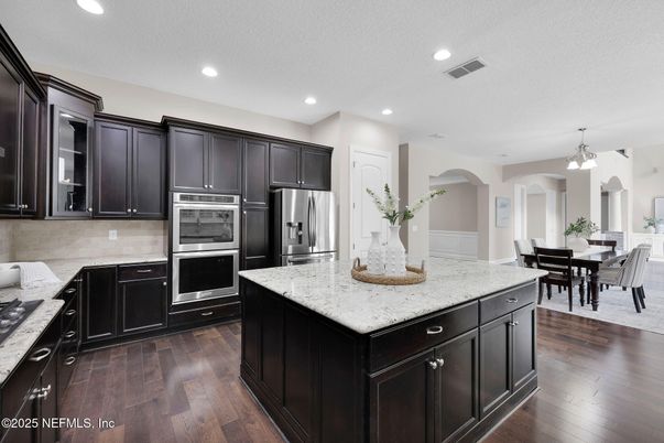 Dining room, Interior, Kitchen, Recessed Lighting, Stainless Steel Appliances, Wood Texture Flooring