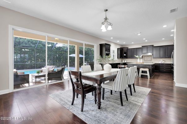 Dining room, Interior, Kitchen, Pendant Lights, Recessed Lighting, Stainless Steel Appliances, Wood Texture Flooring