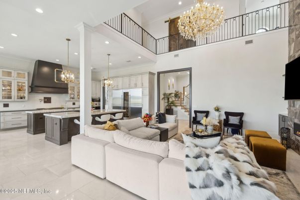 Chandelier, Fireplace, Interior, Kitchen, Living room, Pendant Lights, Recessed Lighting, Stainless Steel Appliances