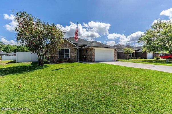 Attached, Backyard, Exterior, Facade, Brick Facade, Ranch