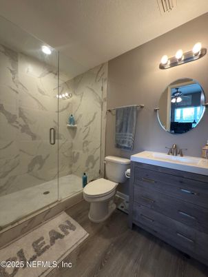 Bathroom, Glass Shower, Interior, Marble Walls, Wood Texture Flooring