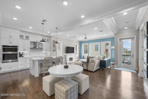 Fireplace, Interior, Kitchen, Living room, Pendant Lights, Recessed Lighting, Stainless Steel Appliances, Wood Texture Flooring
