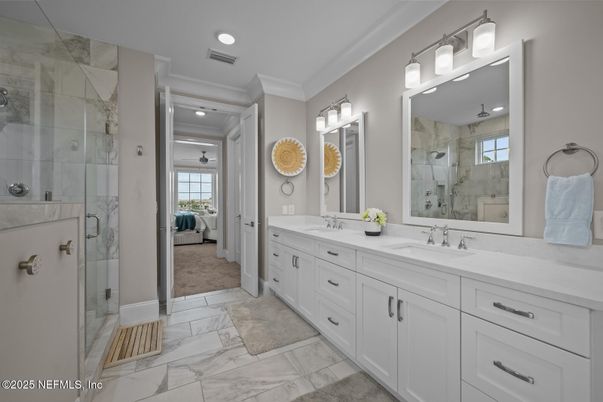 Bathroom, Dual Sink Vanities, Glass Shower, Interior, Marble, Marble Walls, Recessed Lighting