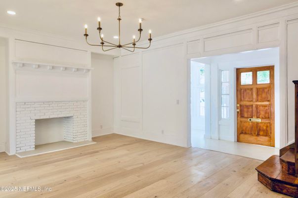 Chandelier, Empty room, Fireplace, Interior, Recessed Lighting, Wood Texture Flooring