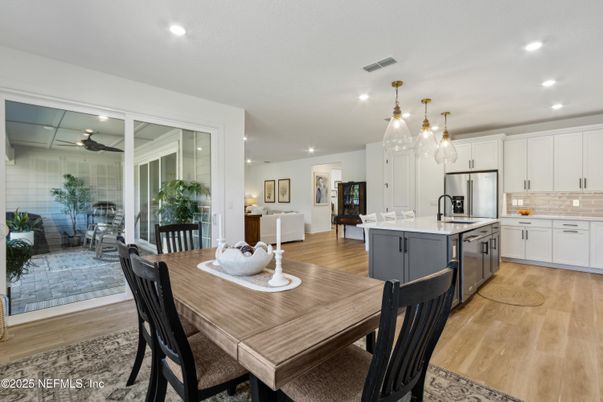 Dining room, Interior, Kitchen, Pendant Lights, Recessed Lighting, Stainless Steel Appliances, Wood Texture Flooring