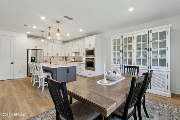 Dining room, Interior, Kitchen, Pendant Lights, Recessed Lighting, Stainless Steel Appliances, Wood Texture Flooring
