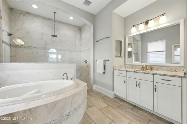 Bathroom, Dual Sink Vanities, Interior, Marble Walls, Recessed Lighting, Wood Texture Flooring
