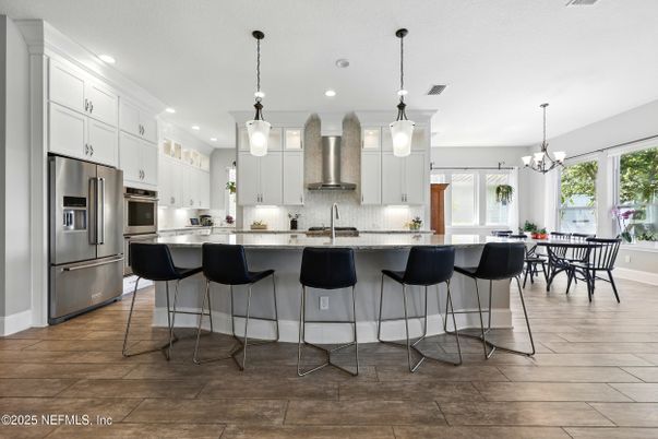 Chandelier, Dining room, Interior, Kitchen, Pendant Lights, Recessed Lighting, Stainless Steel Appliances, Wood Texture Flooring