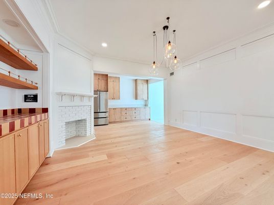 Empty room, Fireplace, Interior, Kitchen, Pendant Lights, Recessed Lighting, Wood Texture Flooring