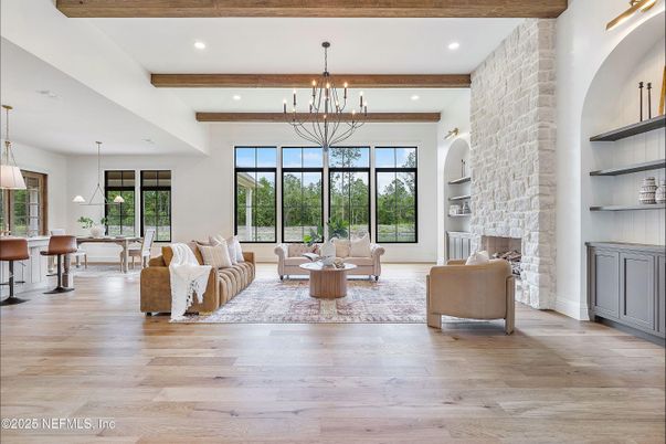 Chandelier, Dining room, Fireplace, Interior, Living room, Pendant Lights, Recessed Lighting, Stone Walls, Wooden Beams, Wood Texture Flooring