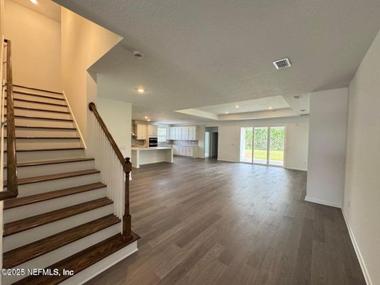 Empty room, Interior, Kitchen, Recessed Lighting, Stainless Steel Appliances, Wood Texture Flooring
