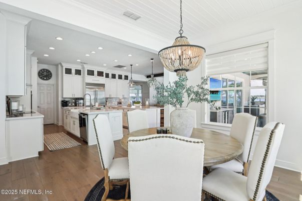 Chandelier, Dining room, Interior, Kitchen, Pendant Lights, Recessed Lighting, Stainless Steel Appliances, Wood Texture Flooring