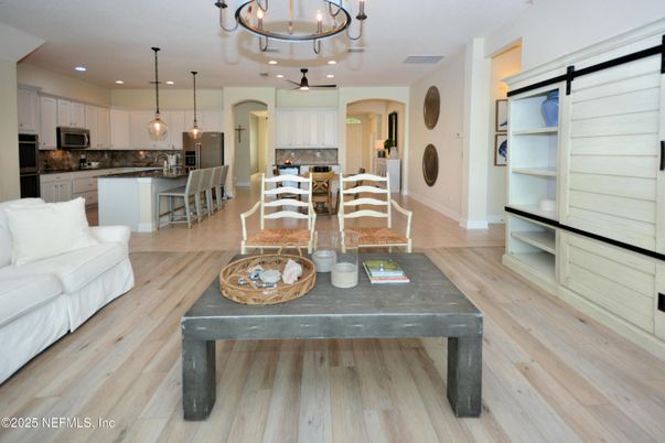 Chandelier, Dining room, Interior, Kitchen, Pendant Lights, Recessed Lighting, Stainless Steel Appliances, Wood Texture Flooring
