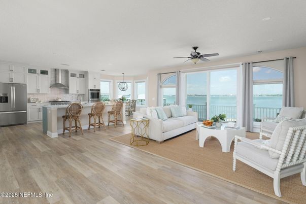 Dining room, Interior, Kitchen, Living room, Pendant Lights, Stainless Steel Appliances, Water, Wood Texture Flooring