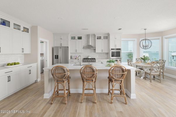 Dining room, Interior, Kitchen, Pendant Lights, Recessed Lighting, Stainless Steel Appliances, Water, Wood Texture Flooring