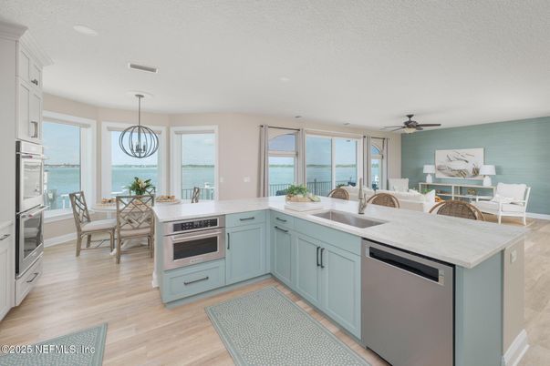 Dining room, Interior, Kitchen, Pendant Lights, Recessed Lighting, Stainless Steel Appliances, Water, Wood Texture Flooring