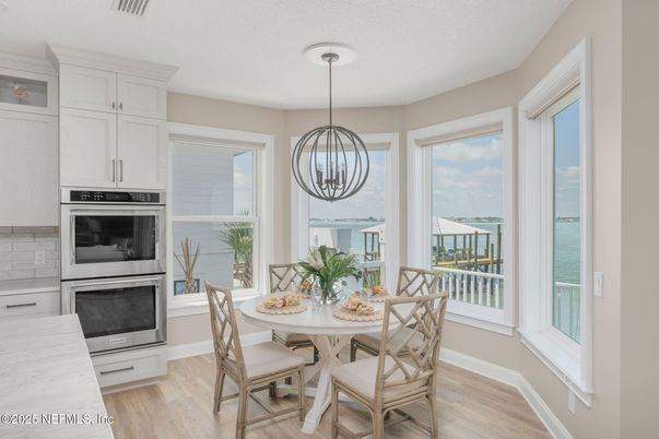 Dining room, Interior, Kitchen, Pendant Lights, Stainless Steel Appliances, Water, Wood Texture Flooring