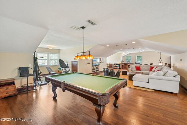 Billiard Table, Chandelier, Game Room, Interior, Living room, Pendant Lights, Recessed Lighting, Wood Texture Flooring
