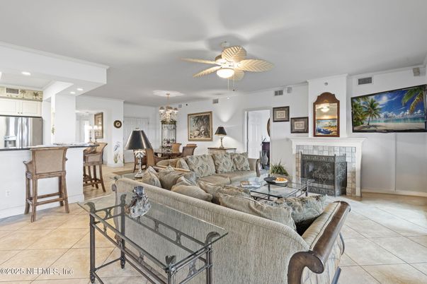 Chandelier, Dining room, Fireplace, Interior, Kitchen, Living room, Pendant Lights, Recessed Lighting, Stainless Steel Appliances