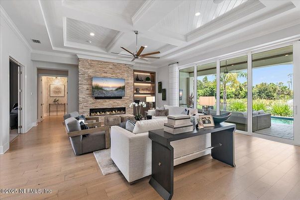 Fireplace, Interior, Living room, Recessed Lighting, Stone Walls, Wood Texture Flooring