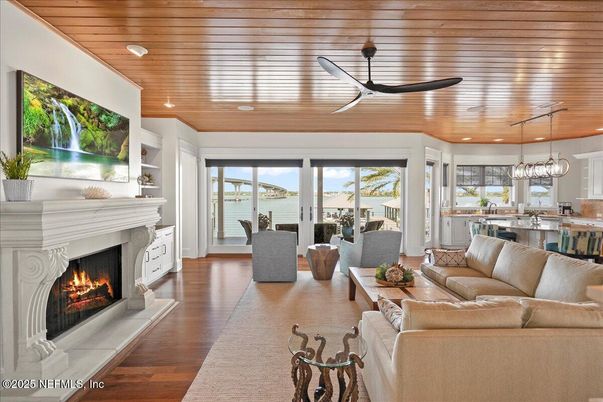 Dining room, Fireplace, Interior, Kitchen, Living room, Pendant Lights, Recessed Lighting, Water, Wooden Ceilings, Wood Texture Flooring