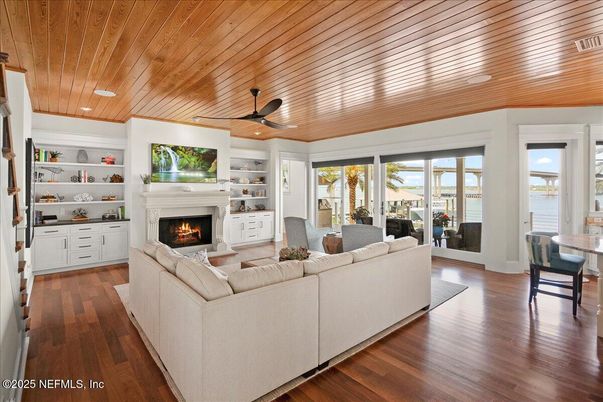 Dining room, Fireplace, Interior, Living room, Recessed Lighting, Water, Wooden Ceilings, Wood Texture Flooring