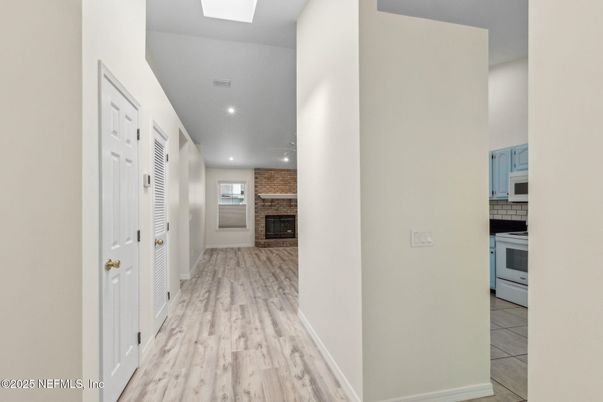Fireplace, Interior, Kitchen, Recessed Lighting, Wood Texture Flooring