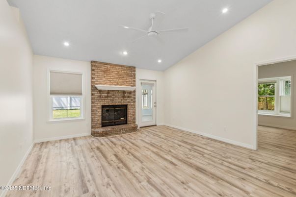 Empty room, Fireplace, Interior, Recessed Lighting, Stone Walls, Wood Texture Flooring