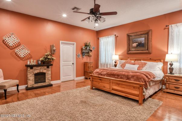 Bedroom, Fireplace, Interior, Recessed Lighting, Wood Texture Flooring