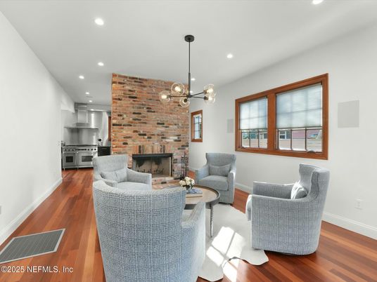 Fireplace, Interior, Kitchen, Living room, Pendant Lights, Recessed Lighting, Stainless Steel Appliances, Stone Walls, Wood Texture Flooring