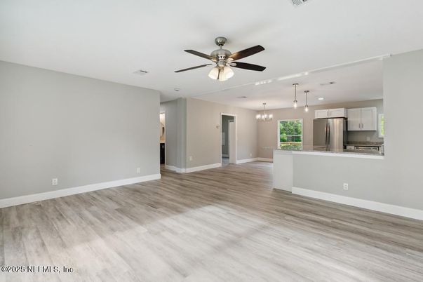 Chandelier, Empty room, Interior, Kitchen, Pendant Lights, Stainless Steel Appliances, Wood Texture Flooring