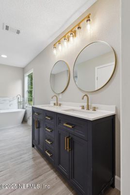 Bathroom, Dual Sink Vanities, Free Standing Baths, Interior, Recessed Lighting, Wood Texture Flooring