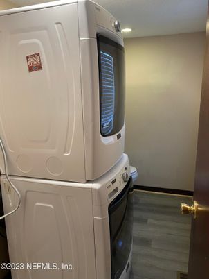 Interior, Kitchen, Recessed Lighting, Washer, Wood Texture Flooring