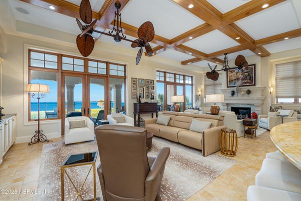 Fireplace, Interior, Living room, Piano, Recessed Lighting, Water, Wooden Beams