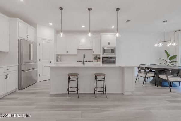 Dining room, Interior, Kitchen, Pendant Lights, Recessed Lighting, Stainless Steel Appliances, Wood Texture Flooring