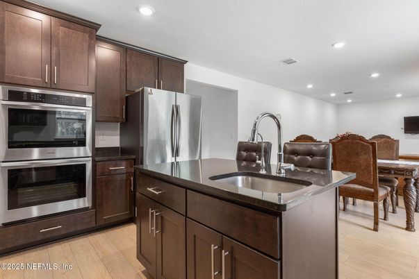 Dining room, Interior, Kitchen, Recessed Lighting, Stainless Steel Appliances, Wood Texture Flooring