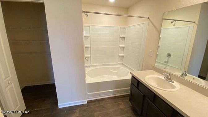 Bathroom, Dual Sink Vanities, Interior, Recessed Lighting, Walk-in Closets, Wood Texture Flooring