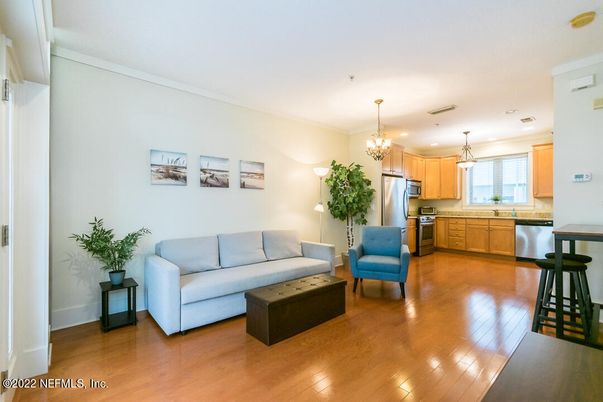Chandelier, Interior, Kitchen, Living room, Pendant Lights, Recessed Lighting, Stainless Steel Appliances, Wood Texture Flooring