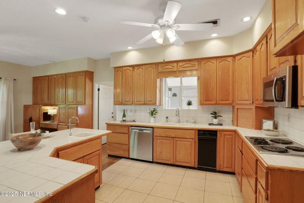 Interior, Kitchen, Recessed Lighting, Stainless Steel Appliances, Tile Countertops