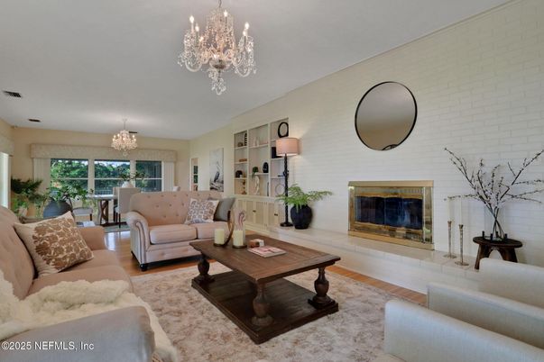 Chandelier, Dining room, Fireplace, Interior, Living room, Stone Walls, Wood Texture Flooring
