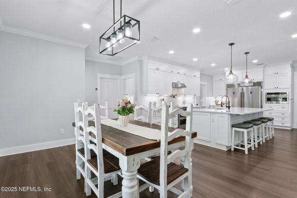 Dining room, Interior, Kitchen, Pendant Lights, Recessed Lighting, Stainless Steel Appliances, Wood Texture Flooring