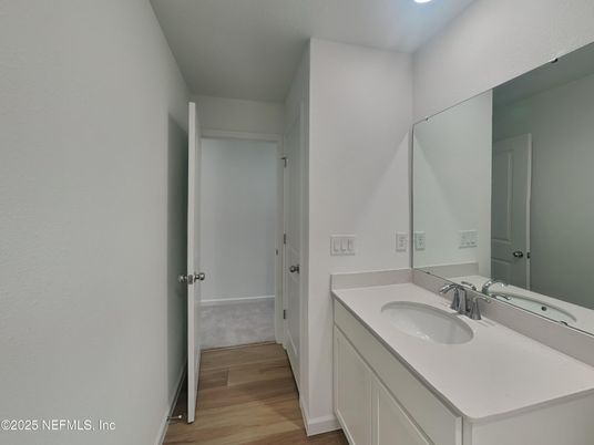 Bathroom, Dual Sink Vanities, Interior, Recessed Lighting, Wood Texture Flooring