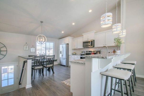 Dining room, Interior, Kitchen, Pendant Lights, Recessed Lighting, Stainless Steel Appliances, Wood Texture Flooring